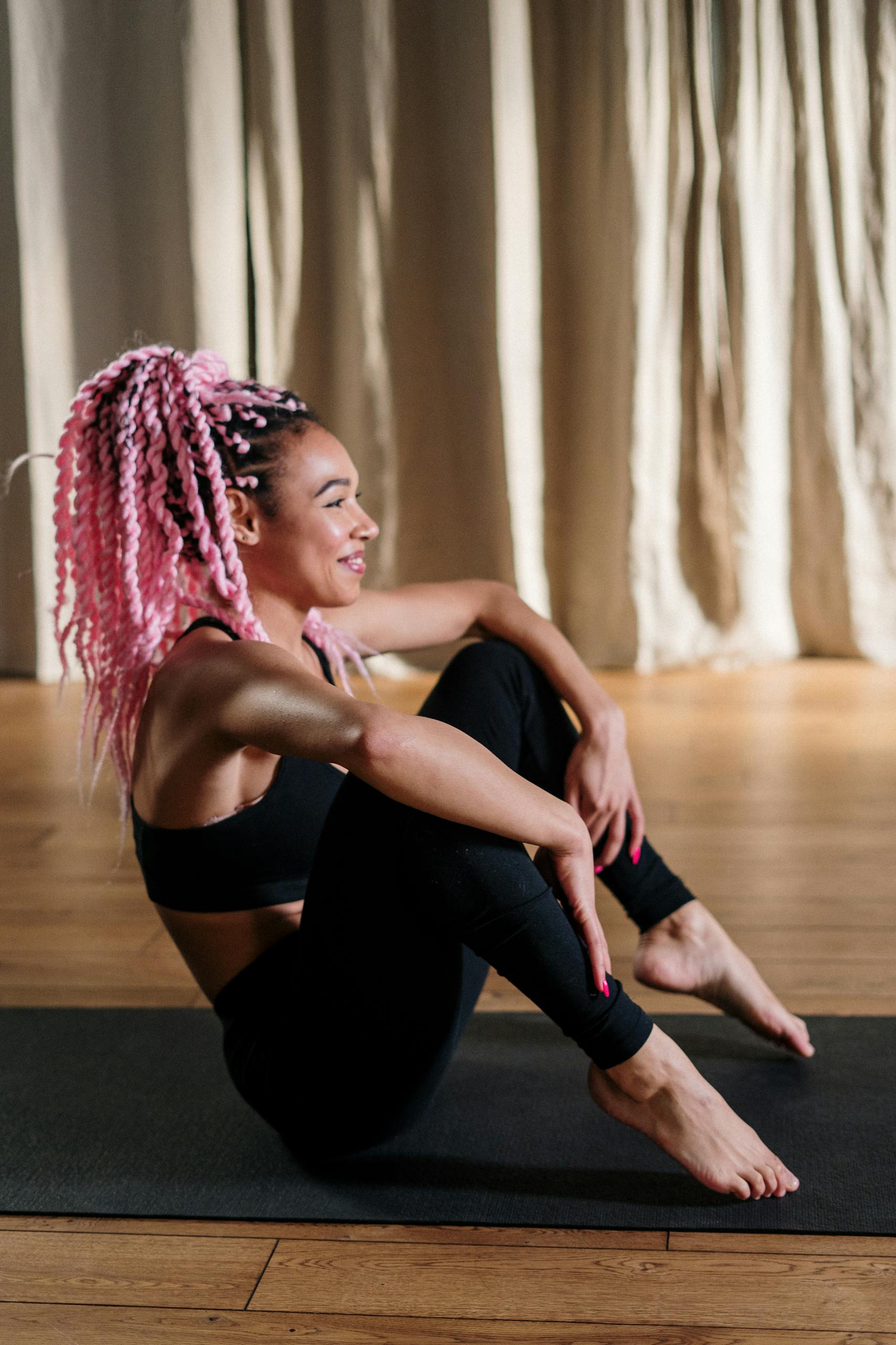 Woman in Black Tank Top and Black Leggings Doing Yoga
